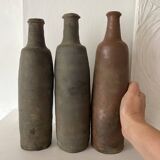 Antique terracotta cider bottles