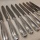 12 silver-plated table knives by Christofle Vendôme, 24.6cm