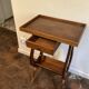 Nightstand in the shape of a lyre.