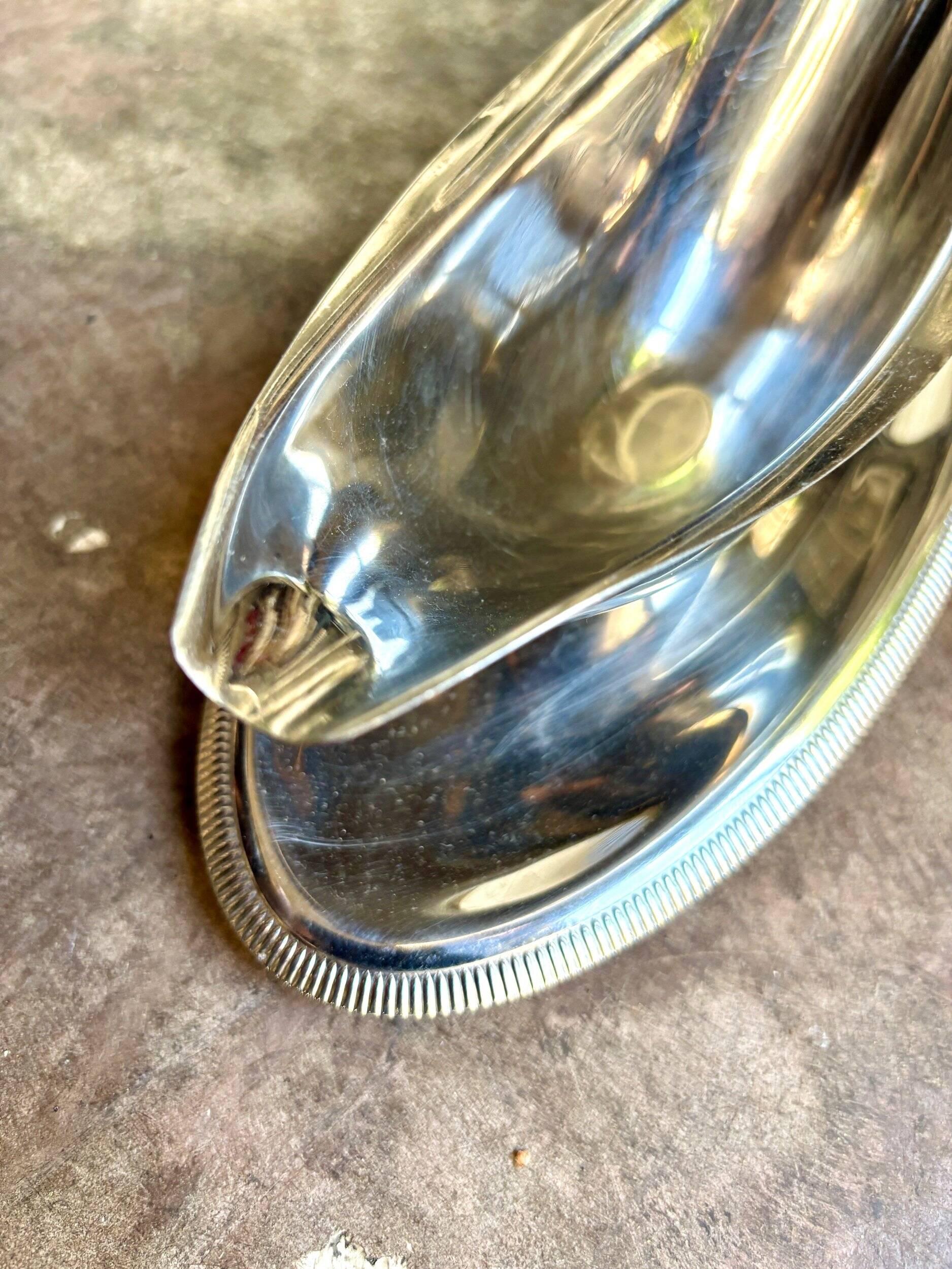 Silver stainless steel gravy boat