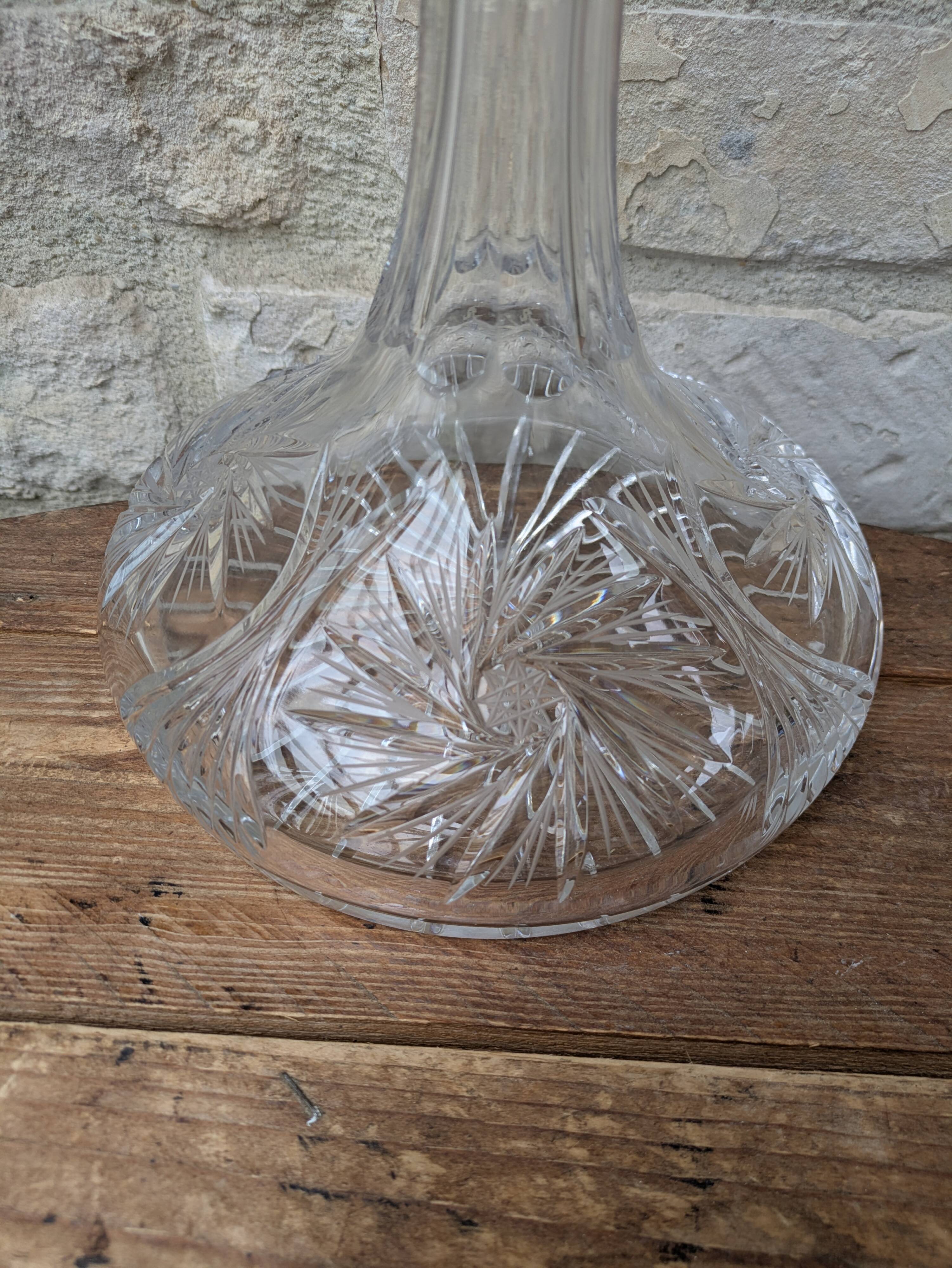 Antique cut crystal decanter with stopper.