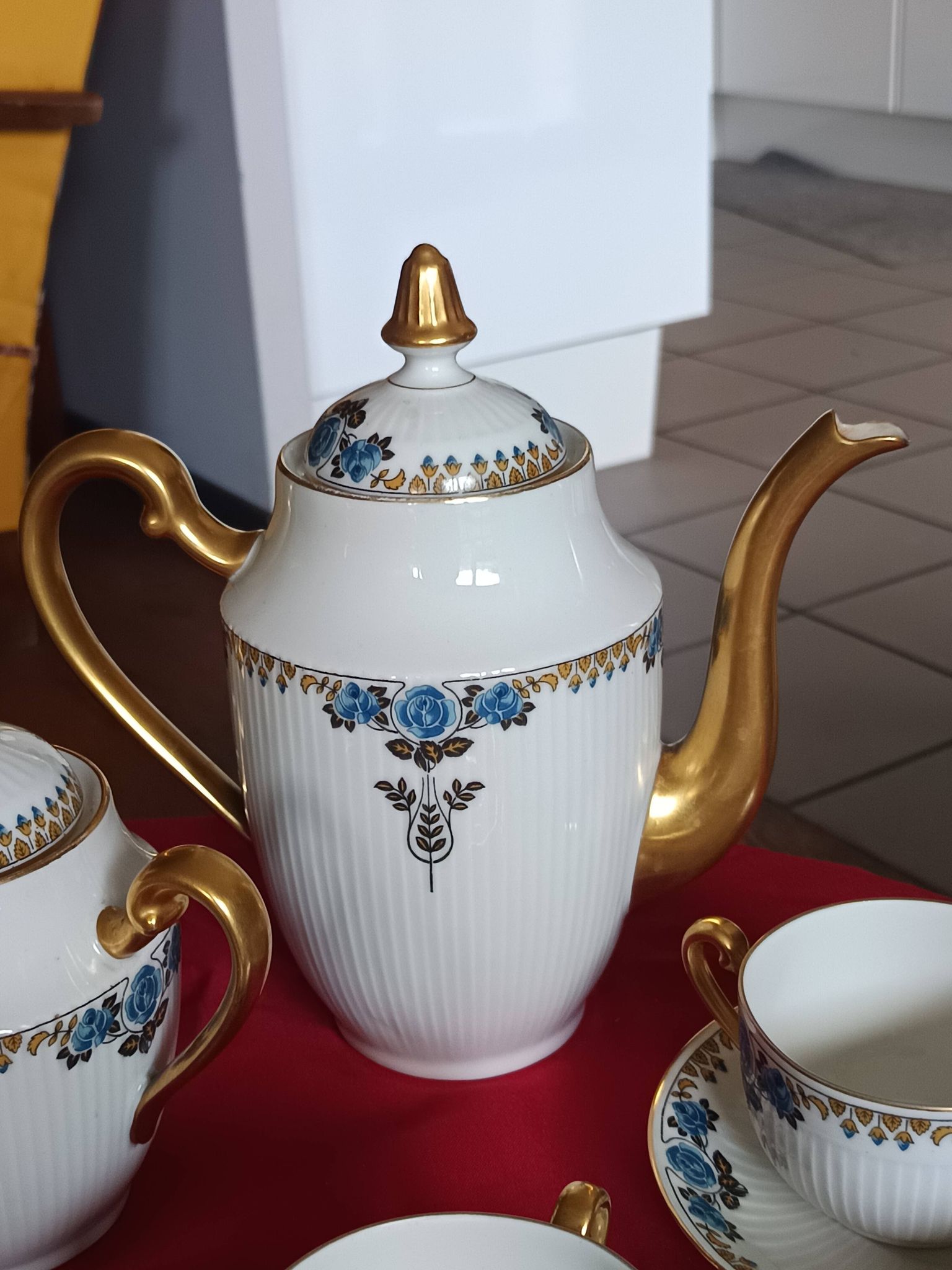 Antique Limoges porcelain coffee/tea service – 14 pieces with blue rose decoration.
