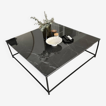 Coffee table with ceramic top and wrought iron base