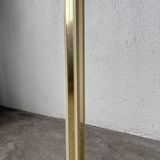 Floor lamp with articulated arm in brass-plated metal