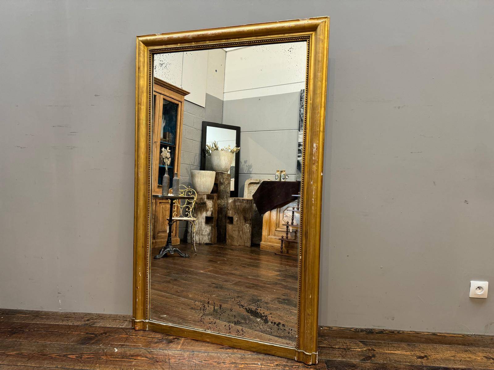 Antique gilded fireplace mirror
