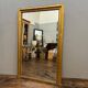 Antique gilded fireplace mirror