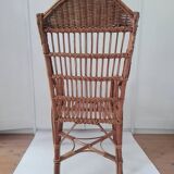 High-backed wicker armchair