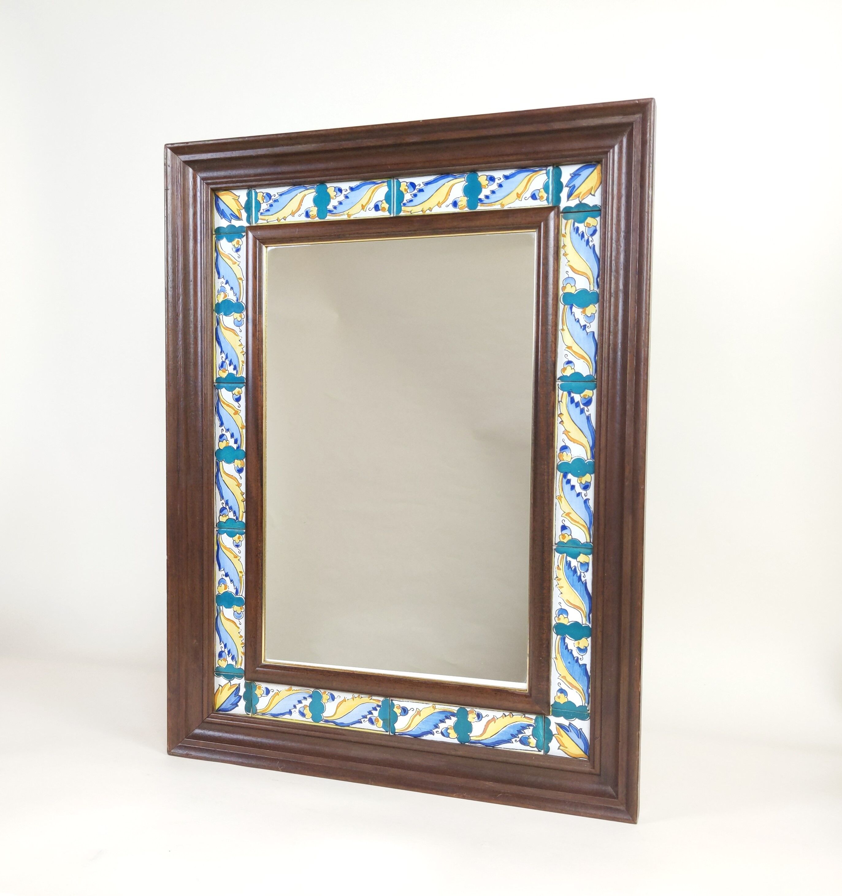 Mirror with wooden frame and painted ceramic tiles