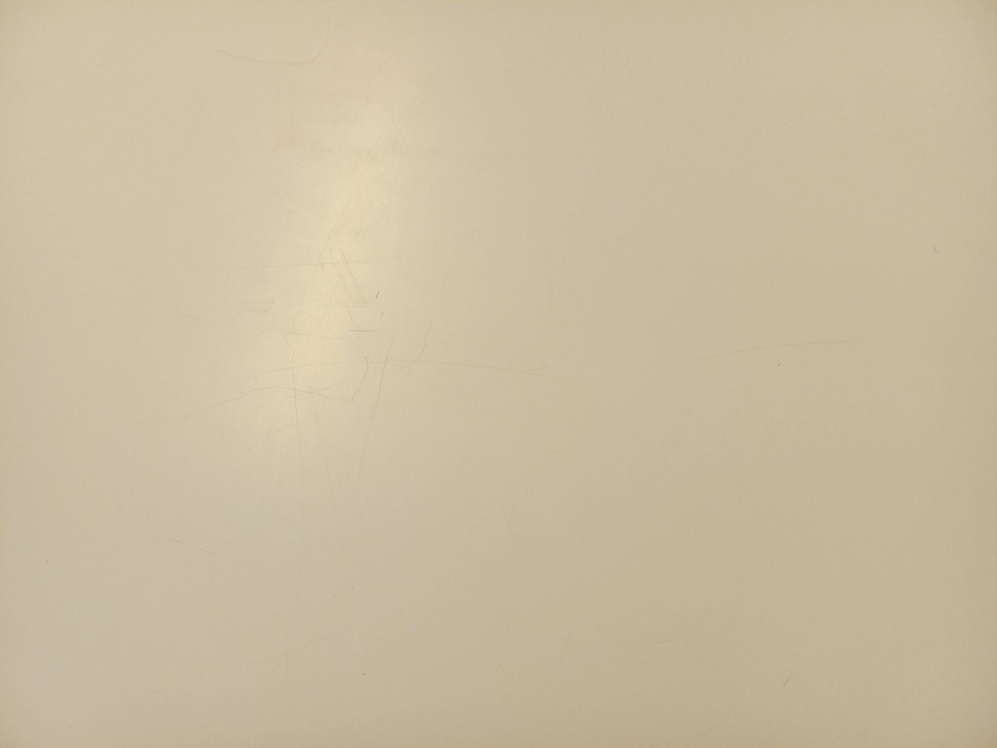Vintage Eames round table for Vitra in white melamine, wood, and metal.