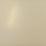 Vintage Eames round table for Vitra in white melamine, wood, and metal.