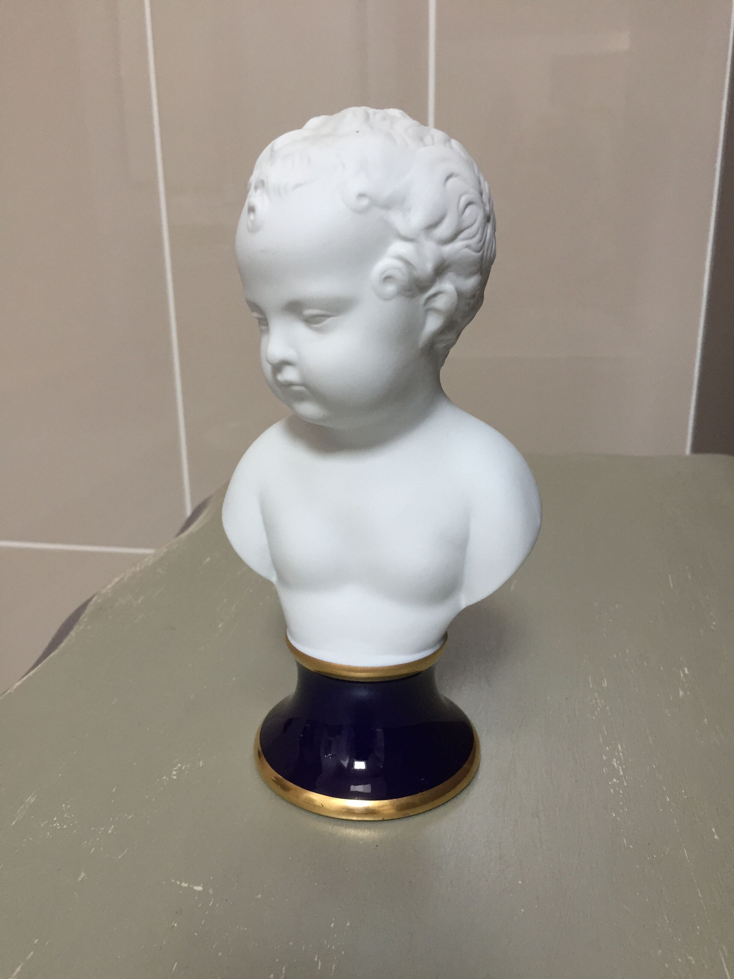 Child bust in limoges porcelain
