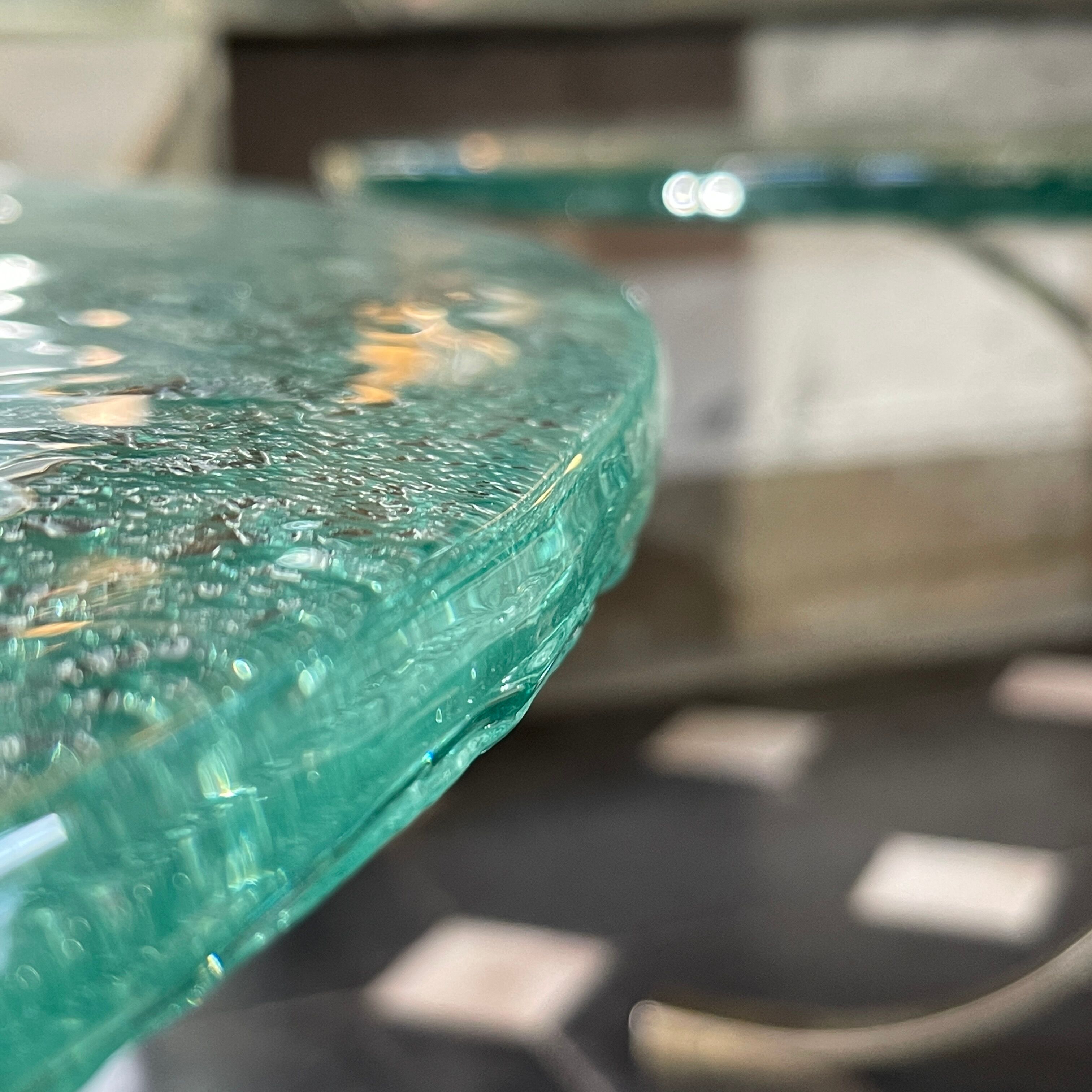 Pair of round coffee tables, glass, ca 1970