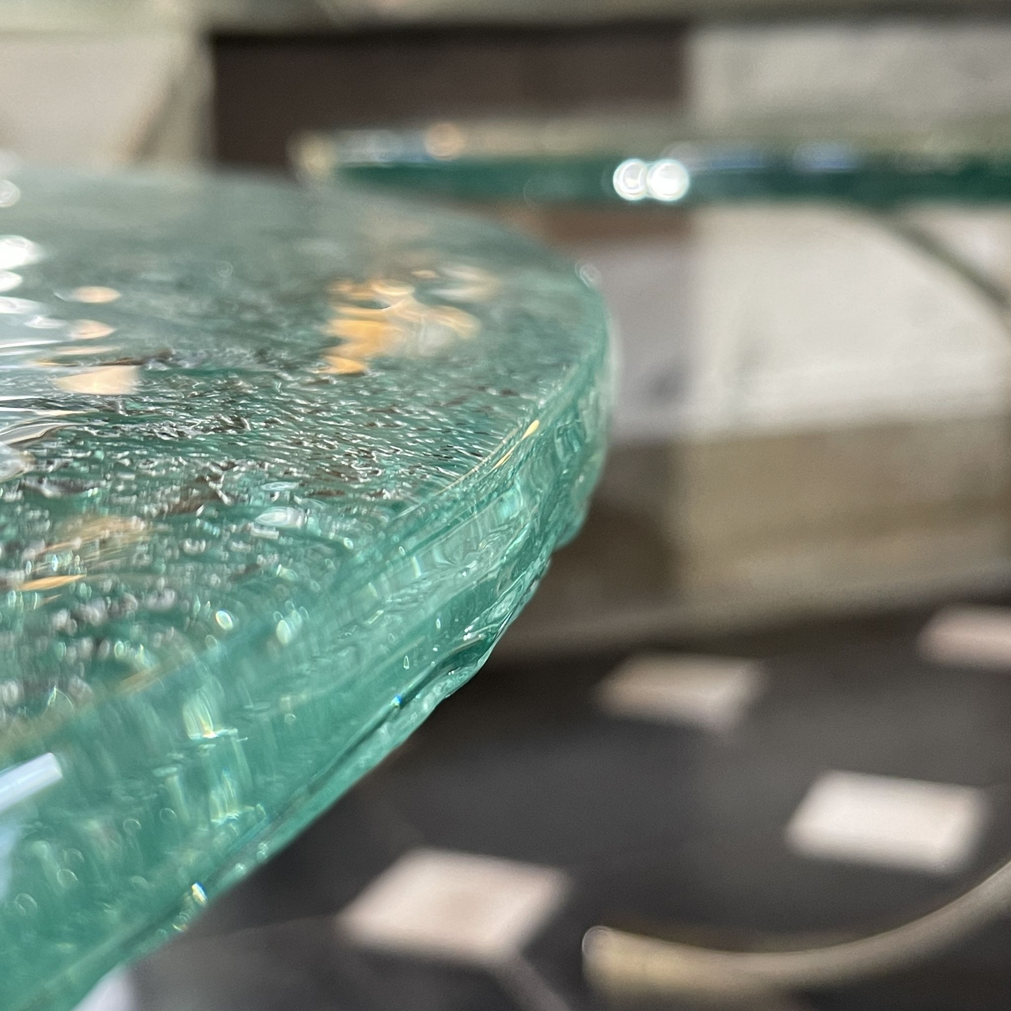 Pair of round coffee tables, glass, ca 1970