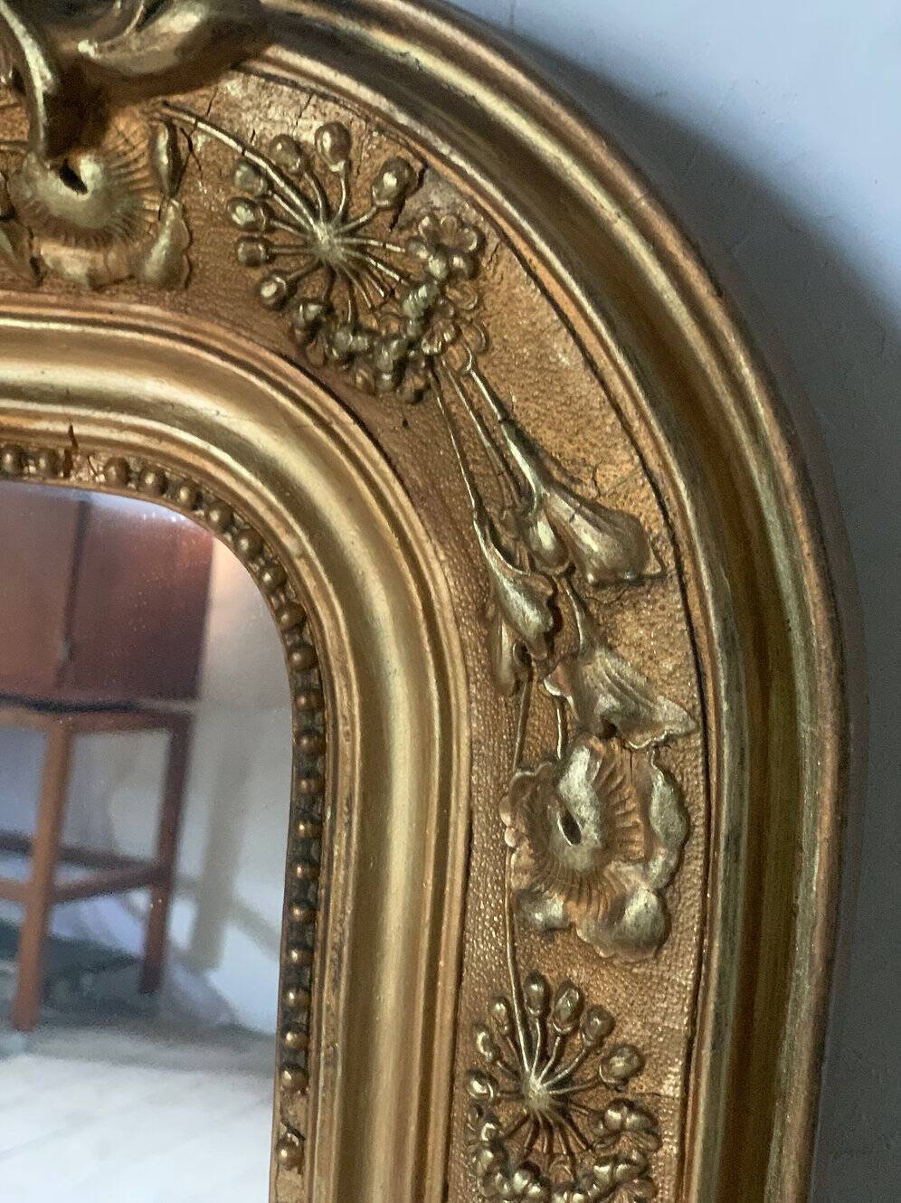 Gilded fireplace mirror with pediment
