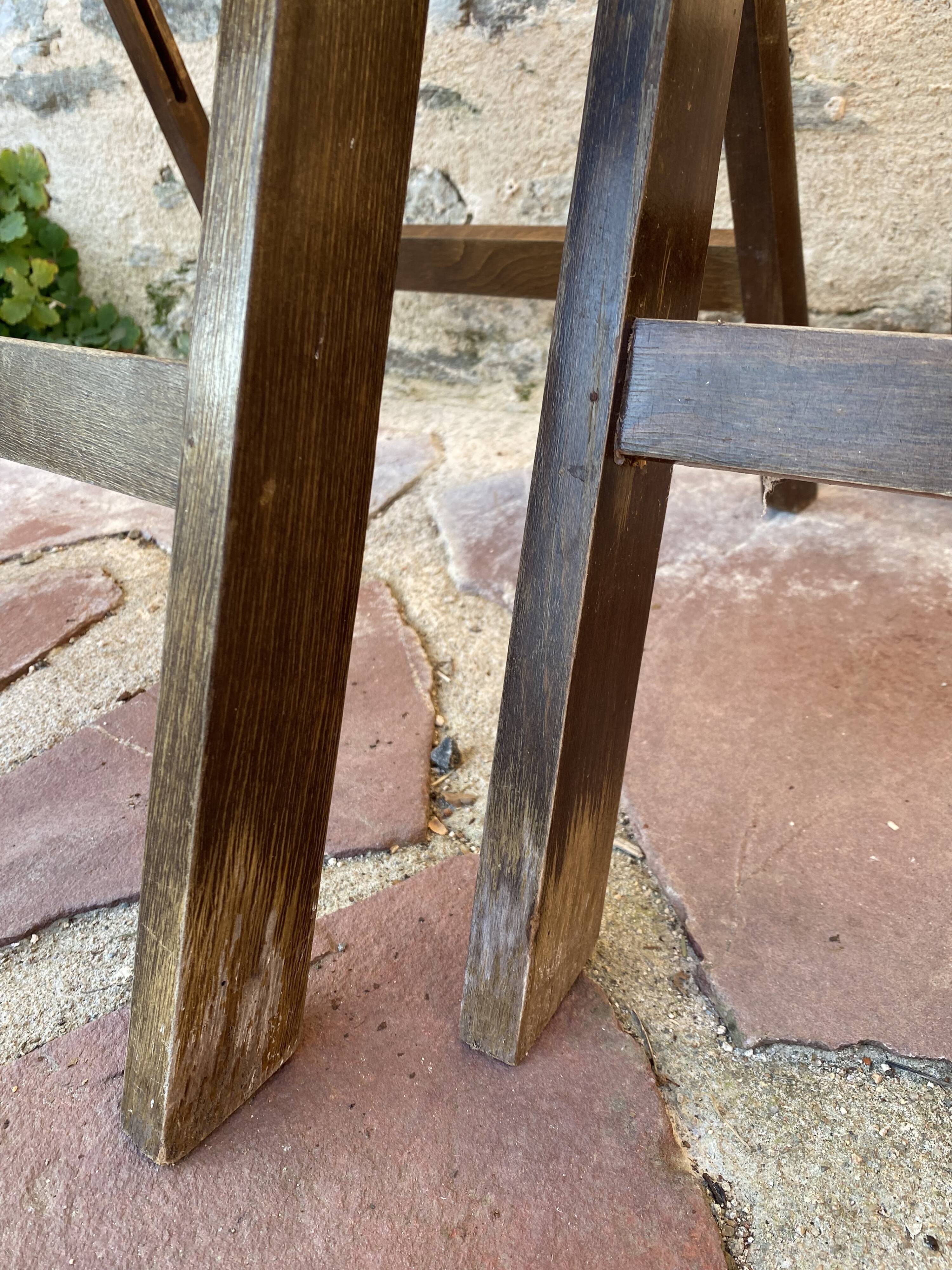 Three wooden folding chairs