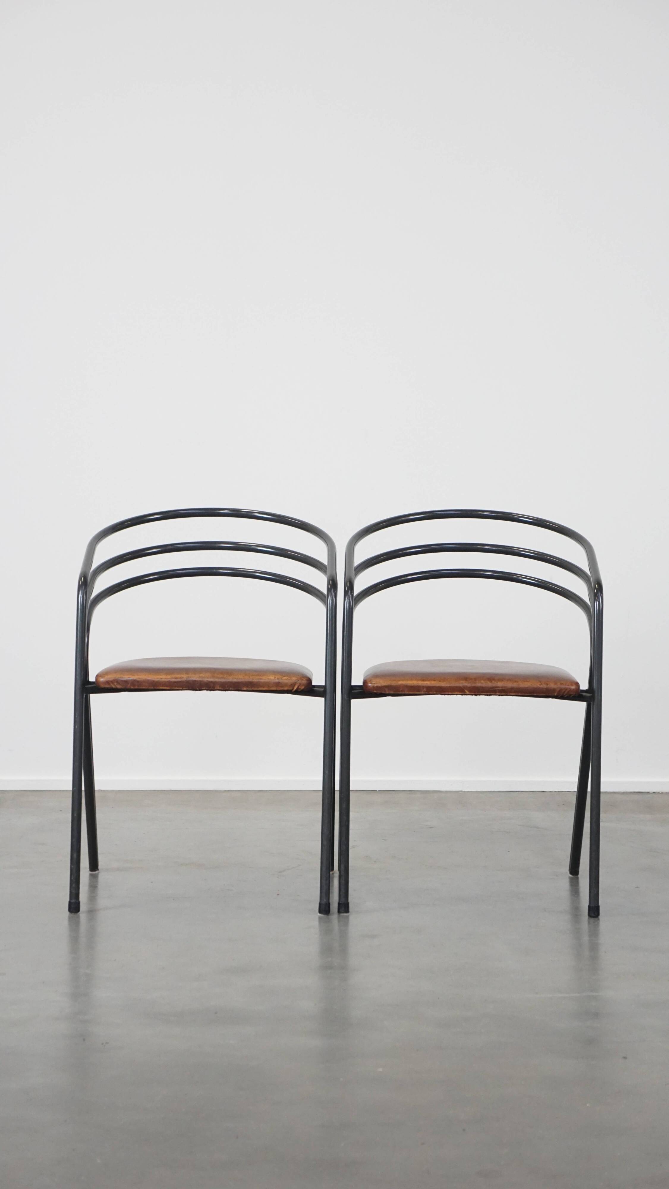 Set of 4 1970s design dining chairs with leather seats and metal frame