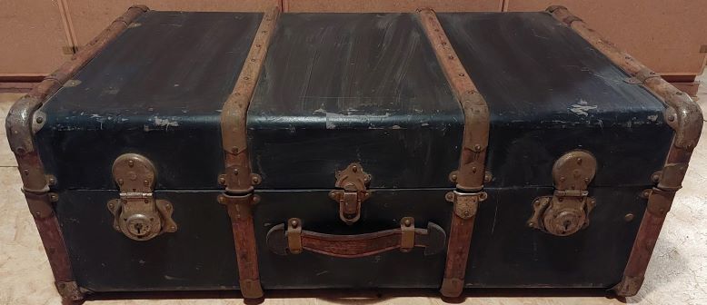 Old black wooden trunk with reinforcements