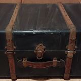 Old black wooden trunk with reinforcements