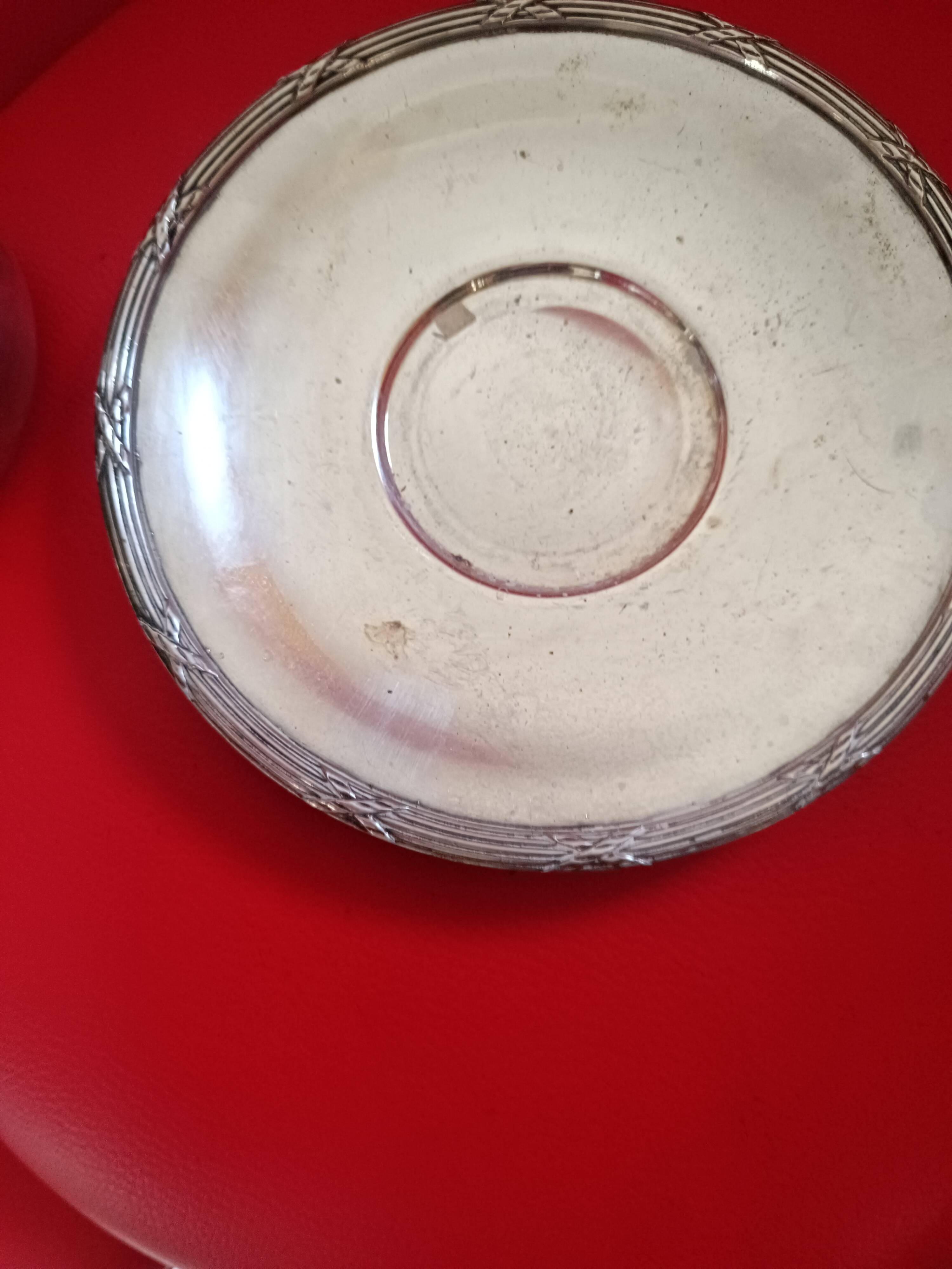 Silver-plated cup and saucer.