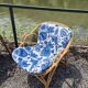Rattan lounge with two armchairs and a vintage 1950s bench.