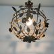 Patinated metal ceiling light with a floral and leaf pattern, 1950s, Italy.