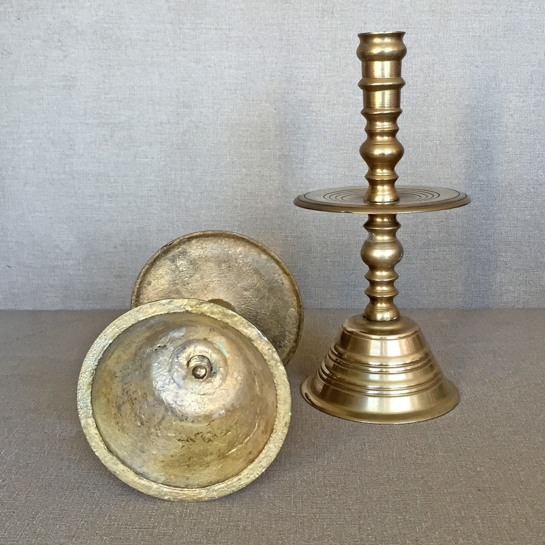 Pair of bronze church candle holders