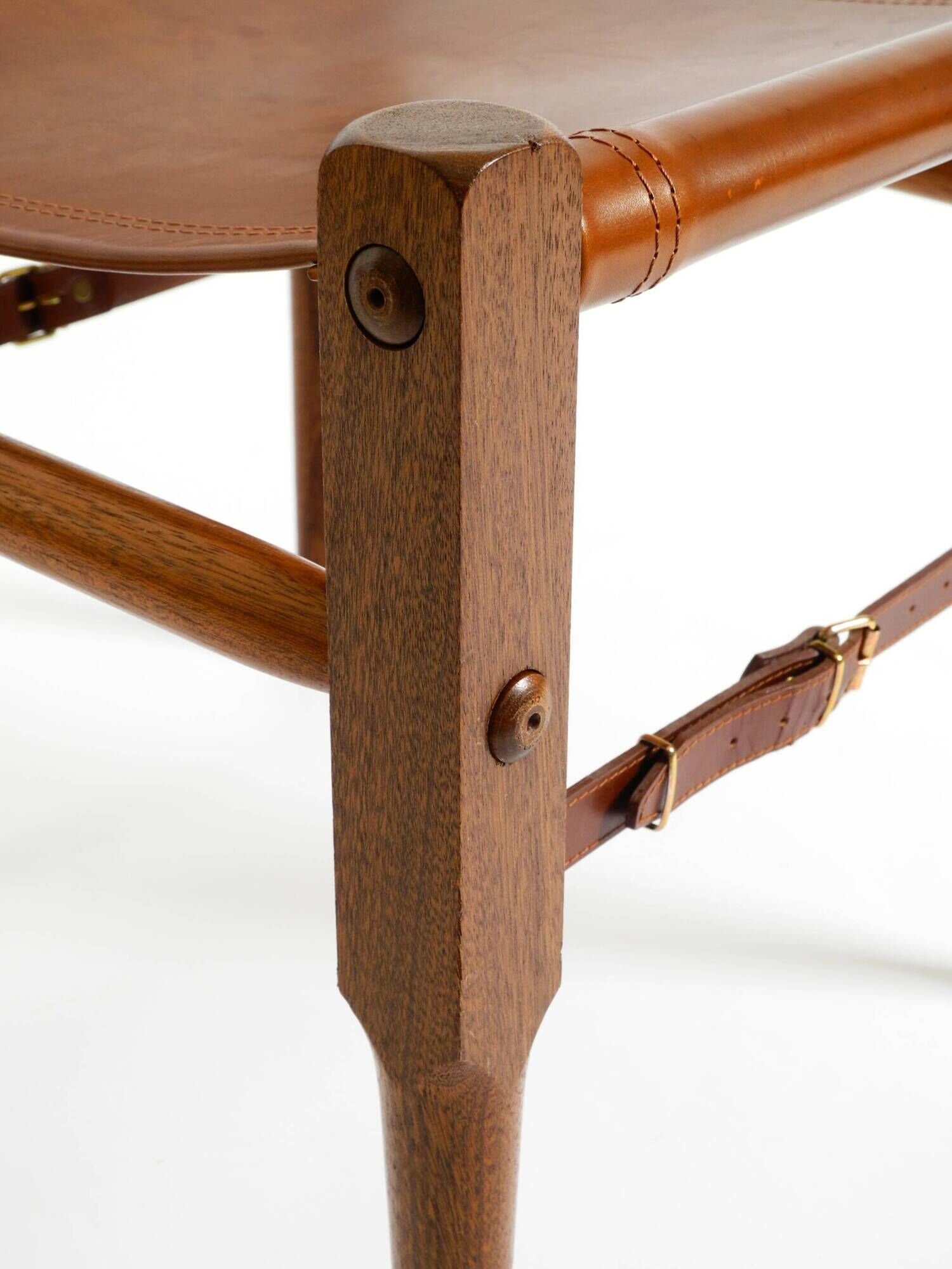 Rare 1990s safari stool with a teak frame and a seat made of brown saddle l
