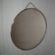 Round barber mirror with chain from the 1950s.