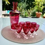 10 glasses and carafe with alcohol or liquor