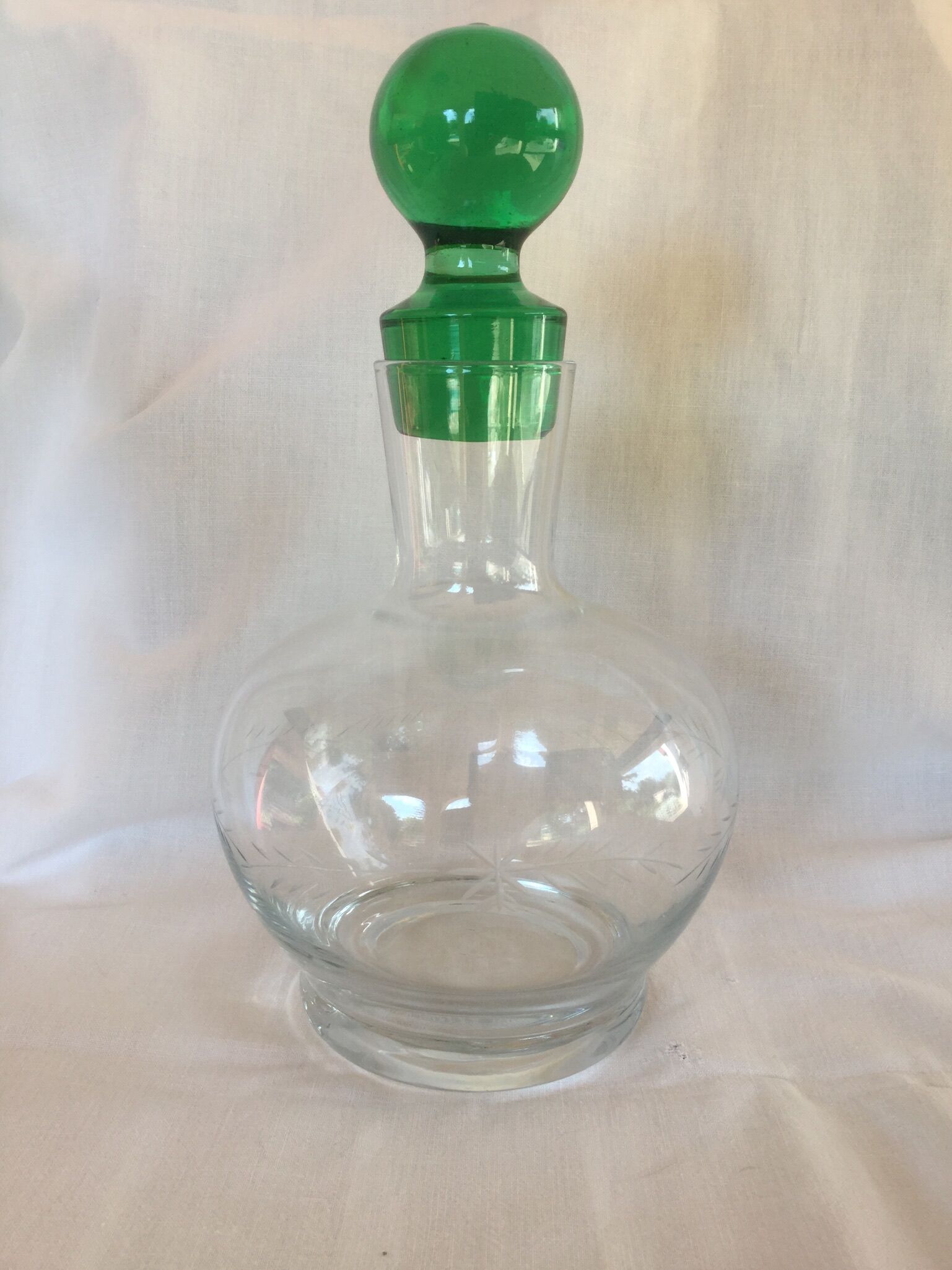 Glass wine carafe with green glass cap