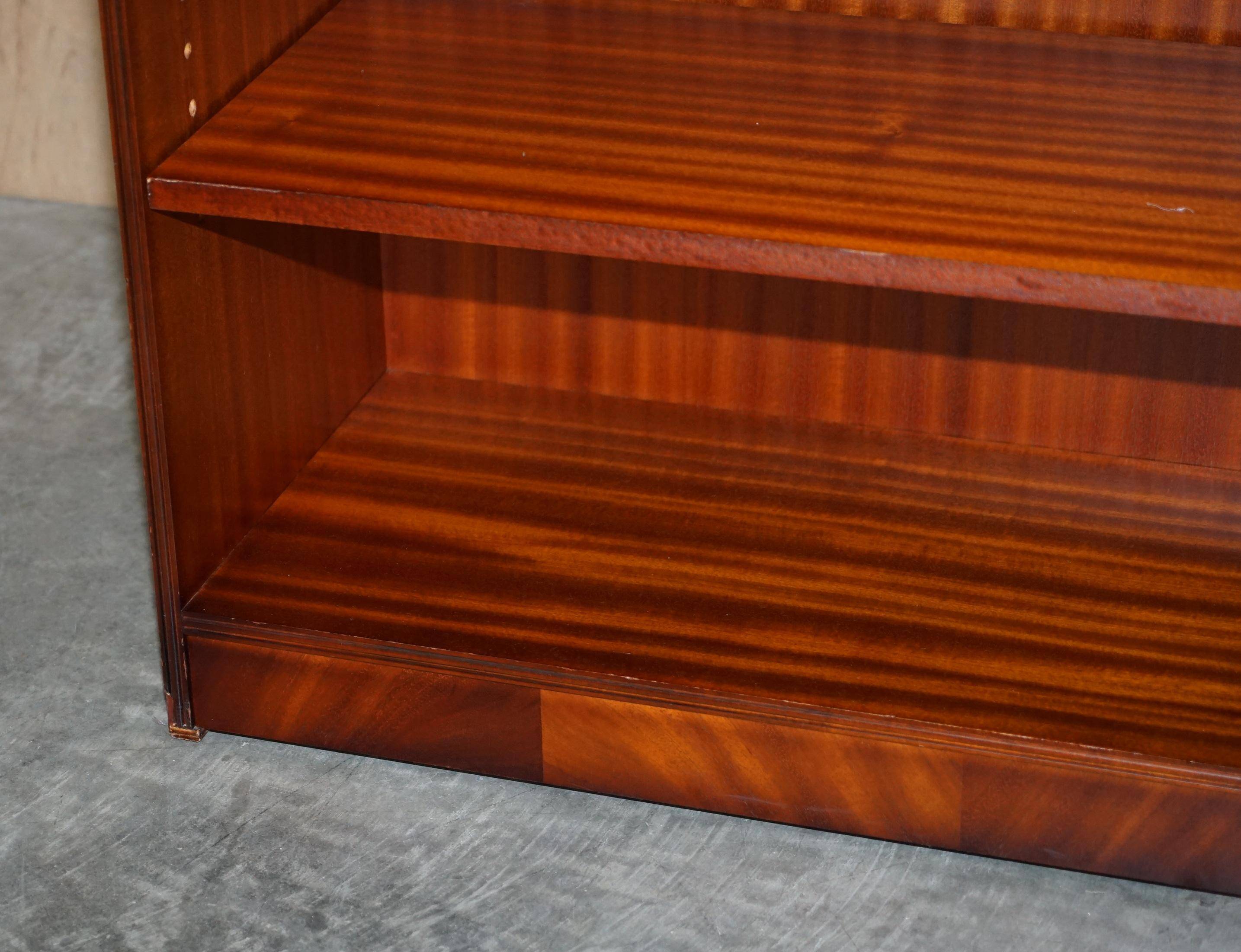 Pair of open low bookshelves Shaws of London in hardwood.
