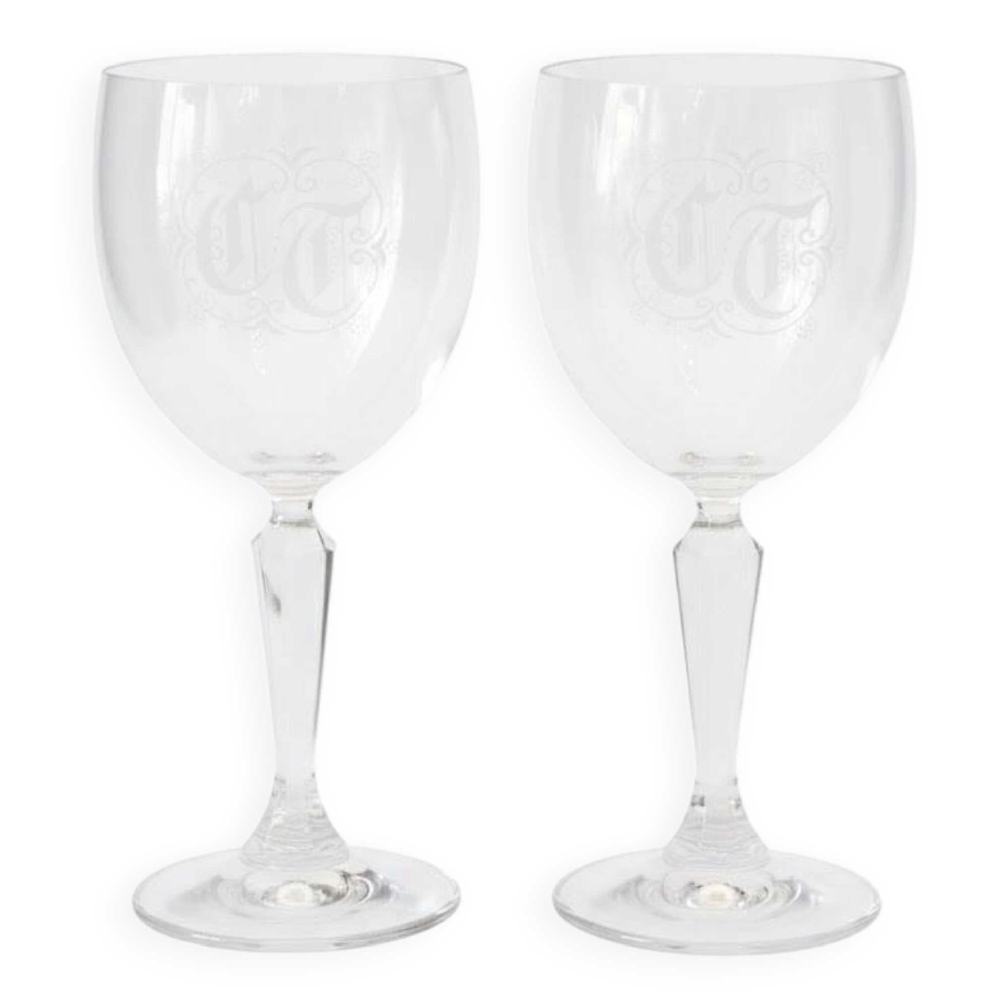 A pair of engraved crystal wine glasses