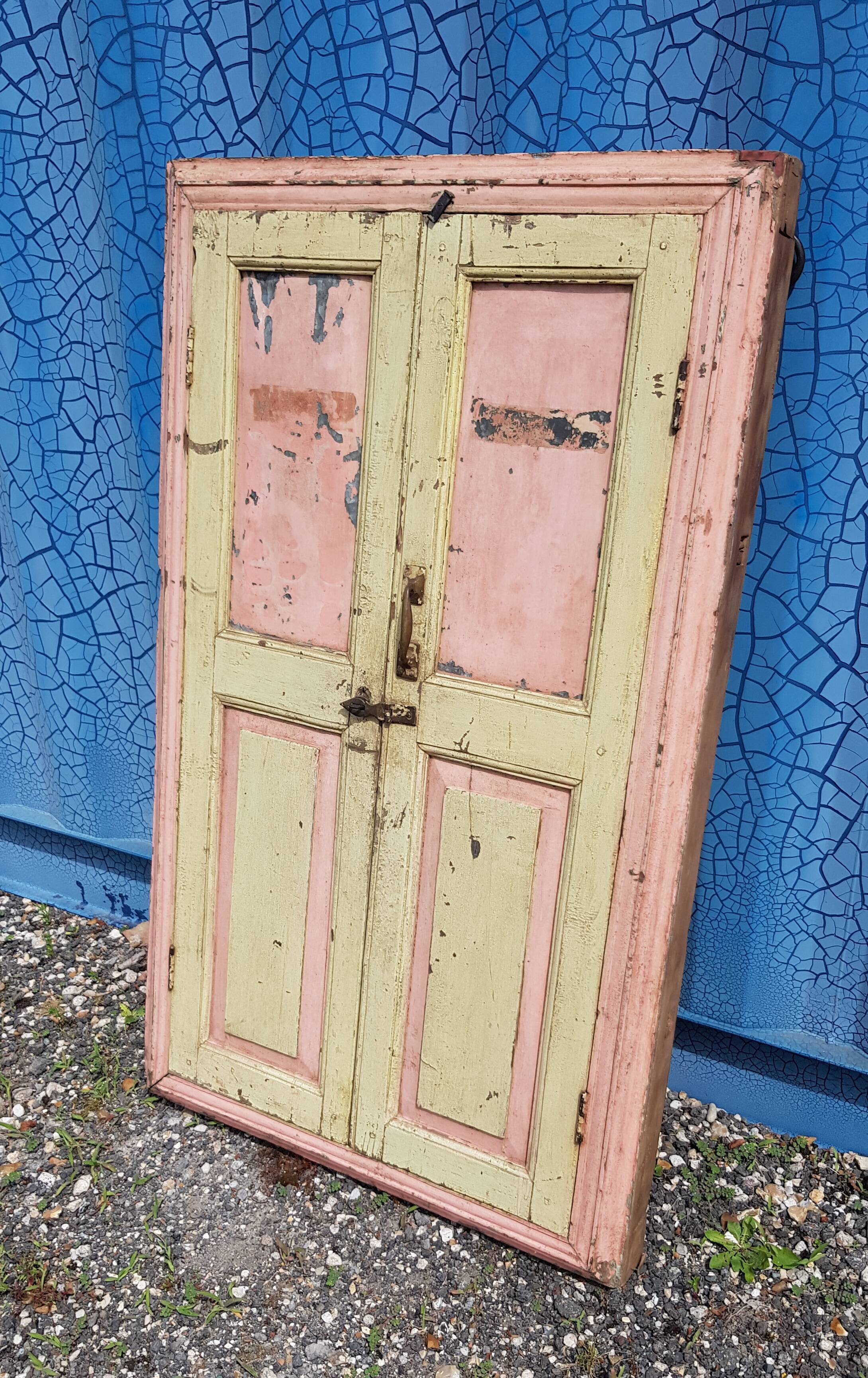 Old polychrome Burmese teak window with interior mirror.