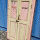 Old polychrome Burmese teak window with interior mirror.