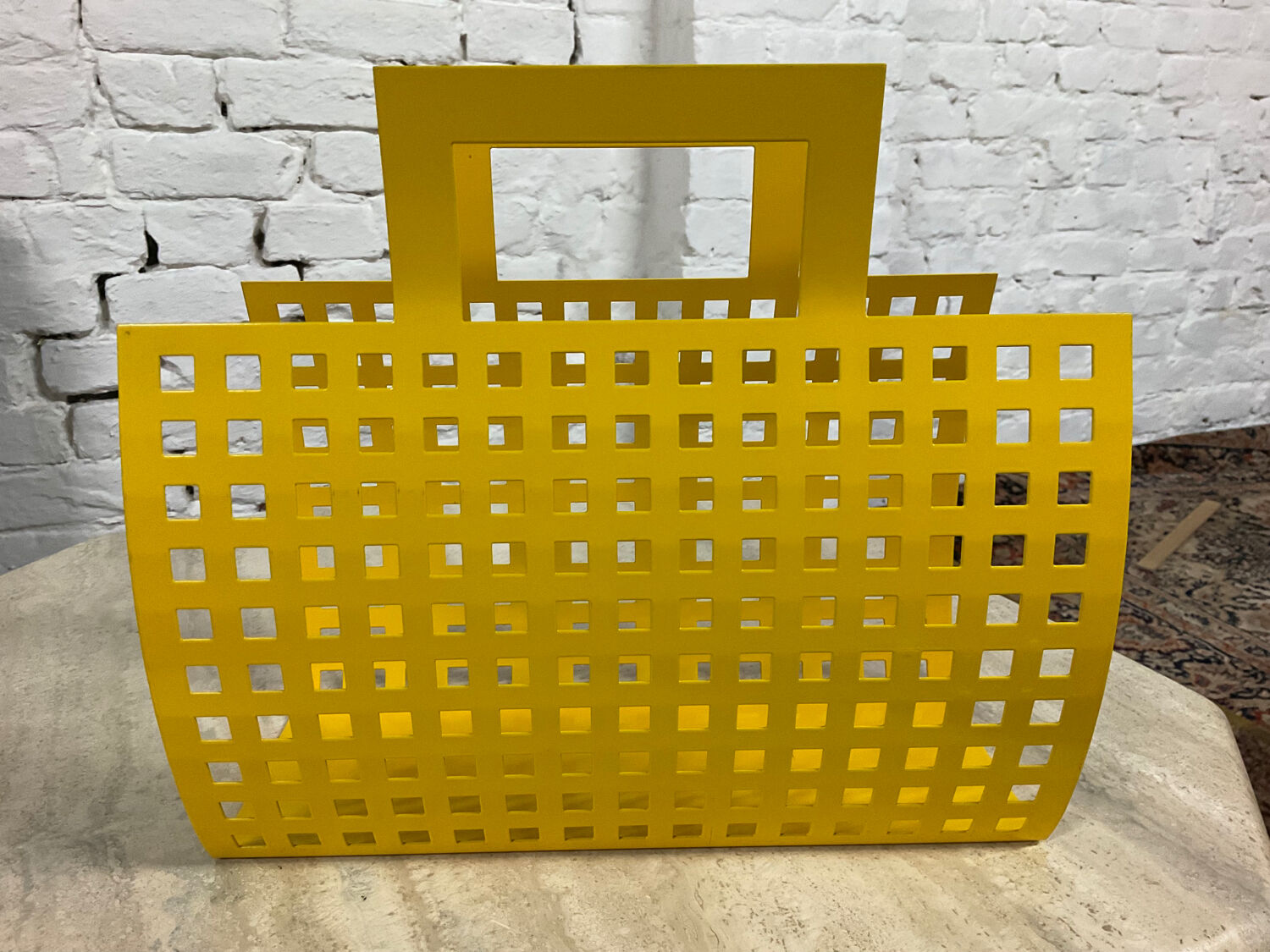 Vintage magazine rack in yellow metal