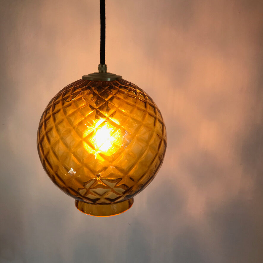 Amber glass globe suspension