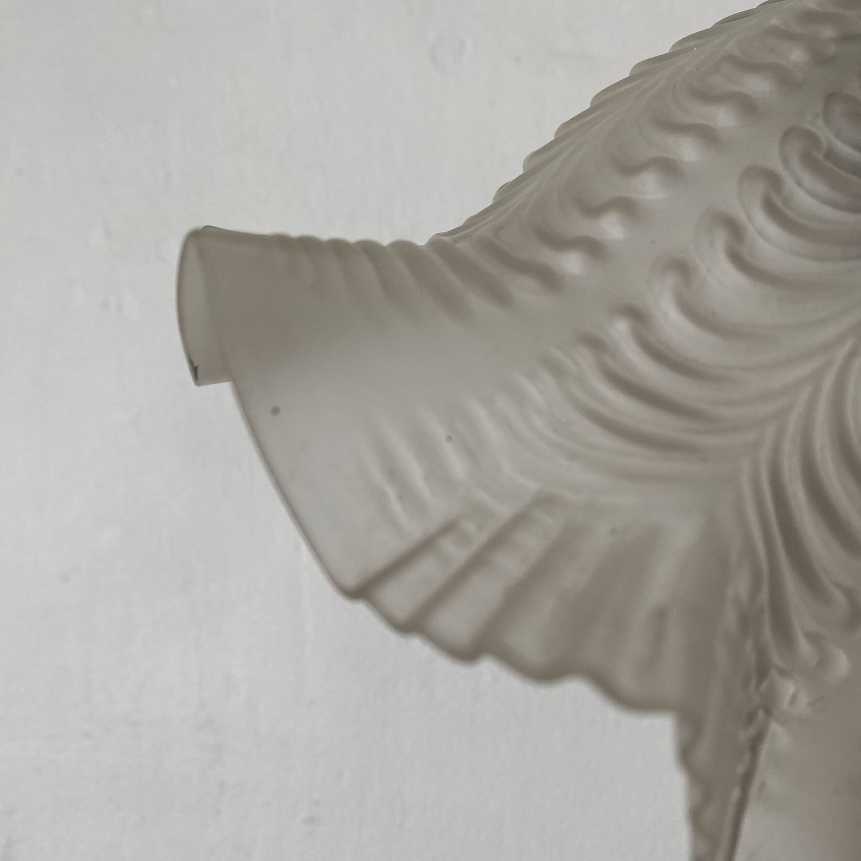 Antique swan neck wall light in brass and porcelain with a glass shade.