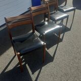 Scandinavian chairs in teak and black skaï.