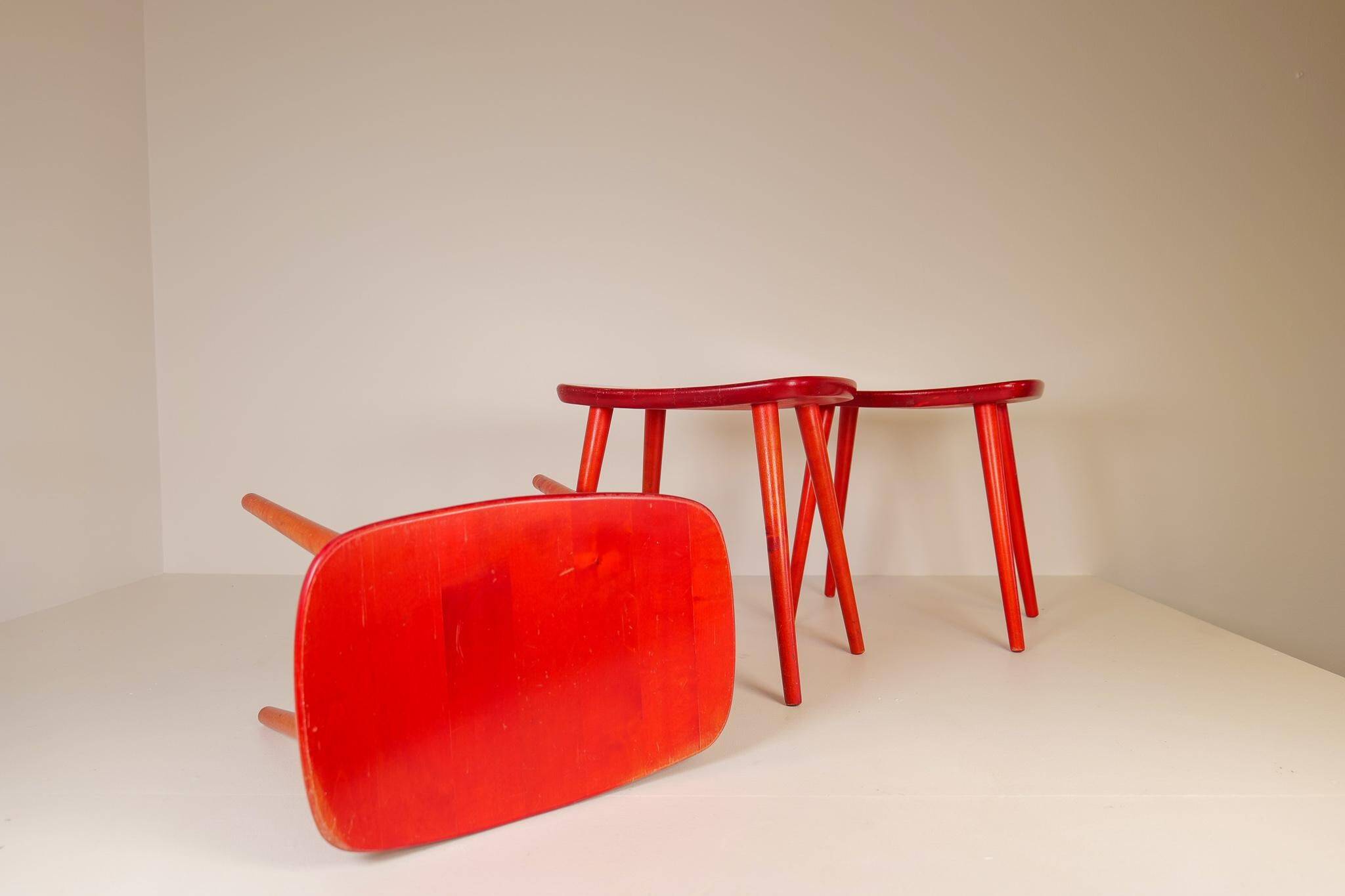 Swedish stools in red lacquered birch, Yngve Ekström "Palle", 1970s