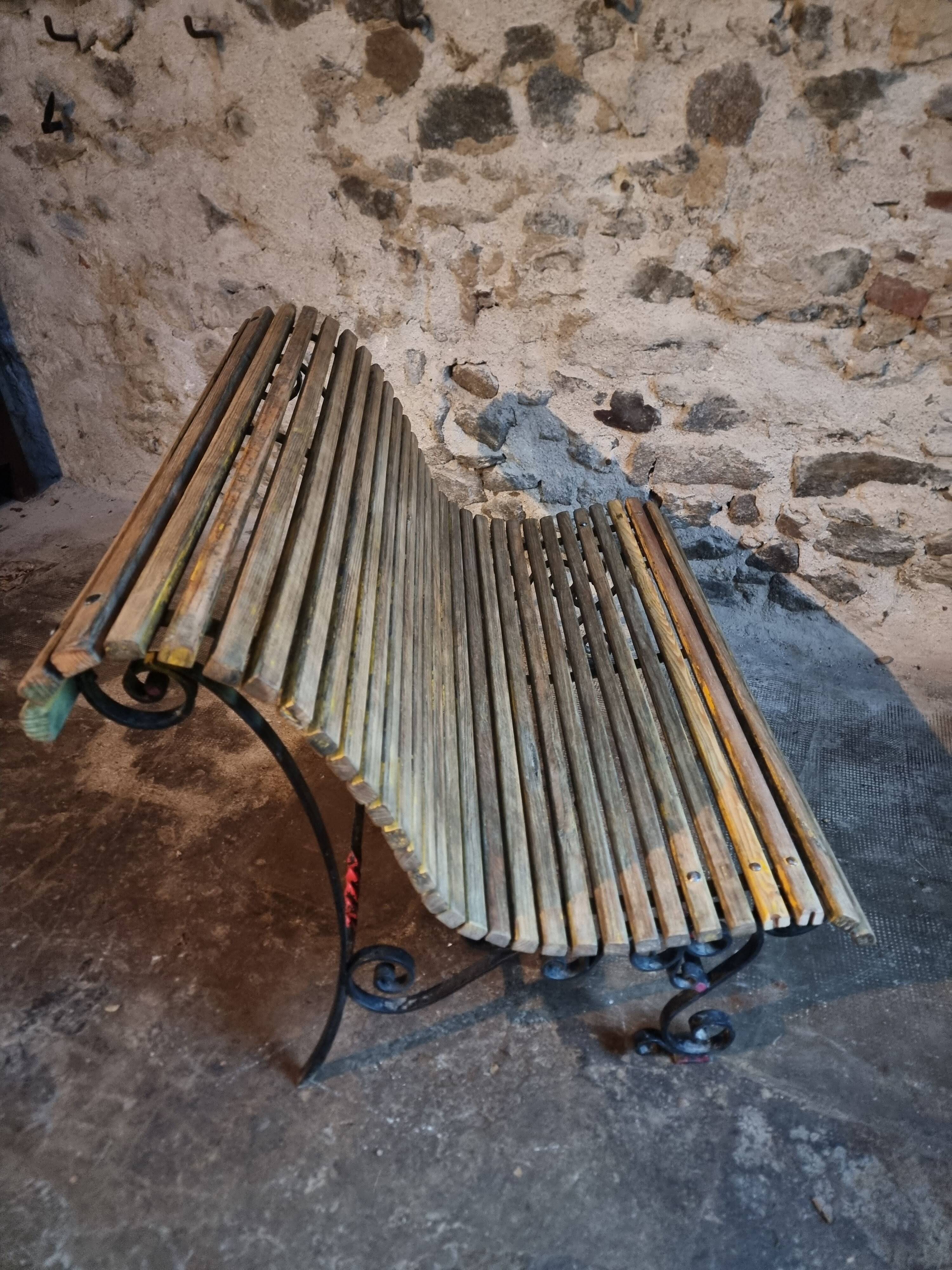 French garden bench in iron and wooden slats, mid-20th century.