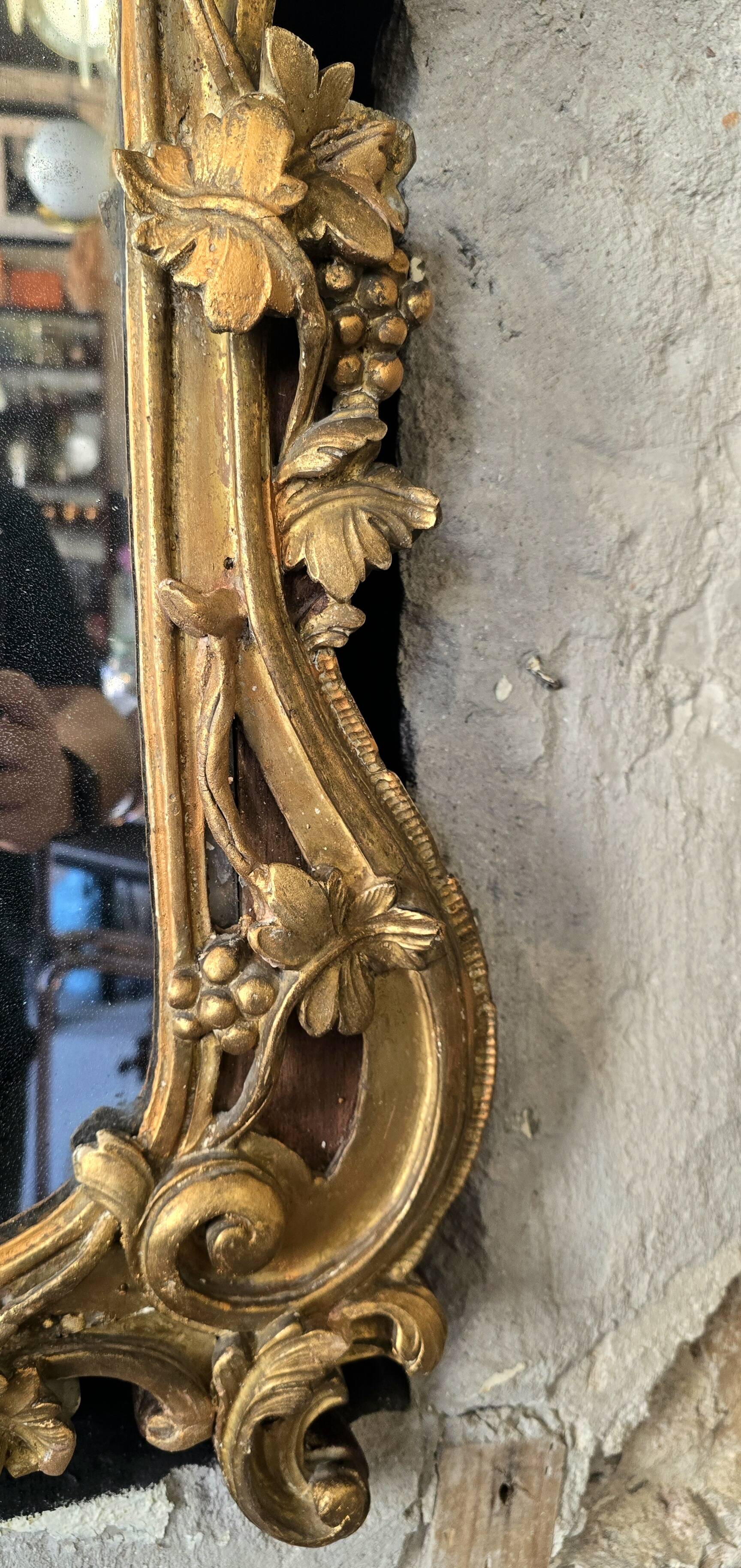 Louis XV period mirror in gilded wood and stucco, 18th century