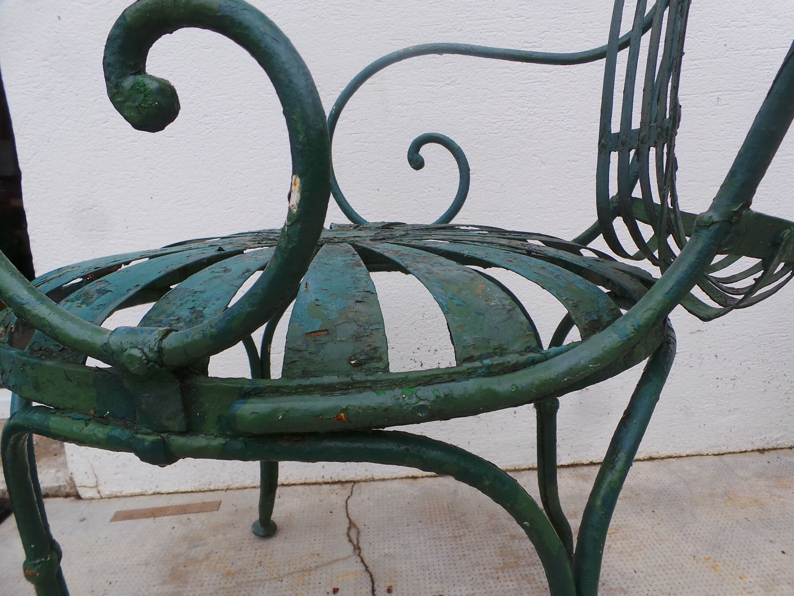 Pair of wrought iron garden chairs by François Carre