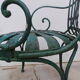 Pair of wrought iron garden chairs by François Carre