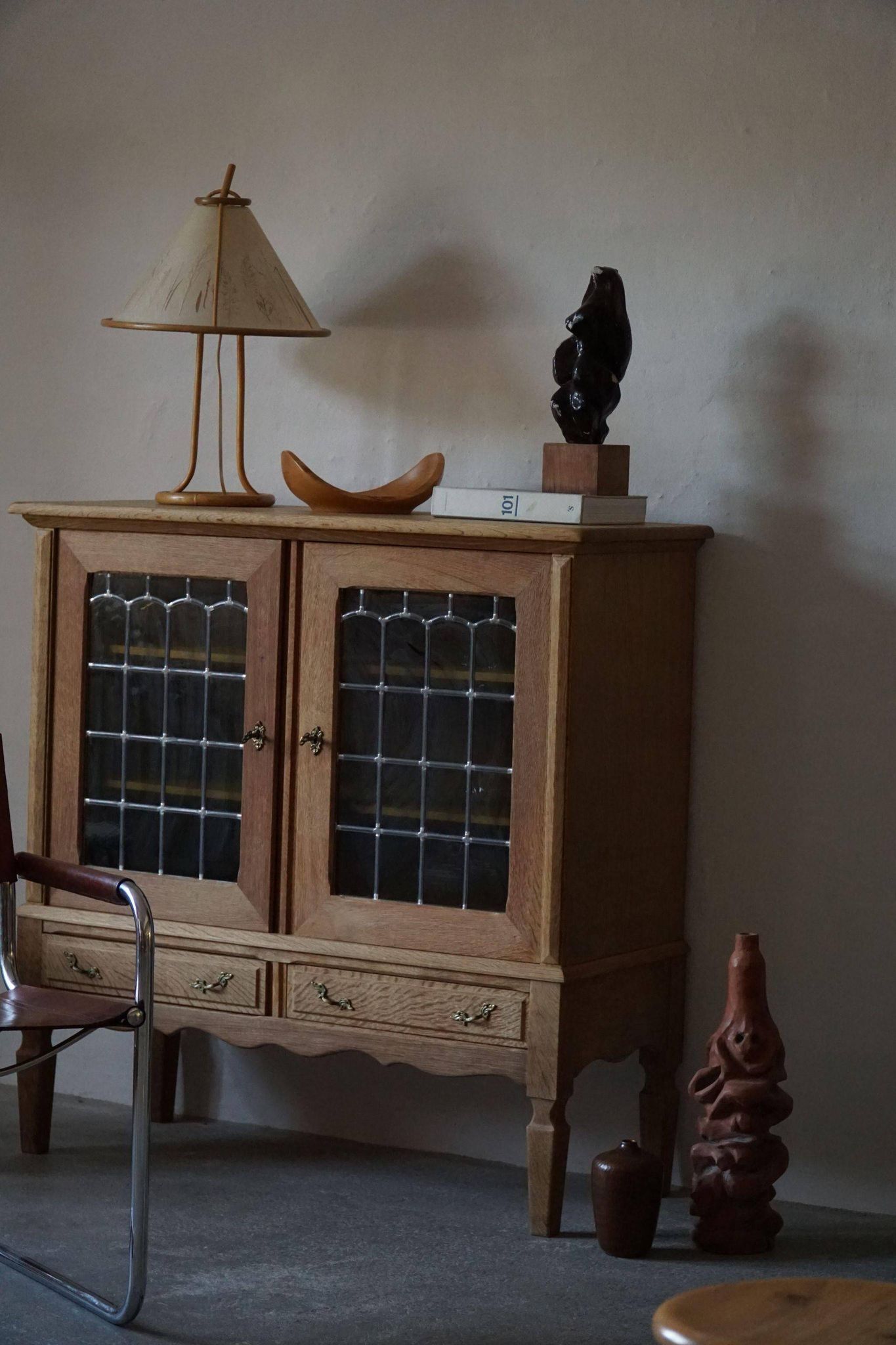 20th-century mid-century solid oak sideboard with glass front, by a Danish cabinetmaker.