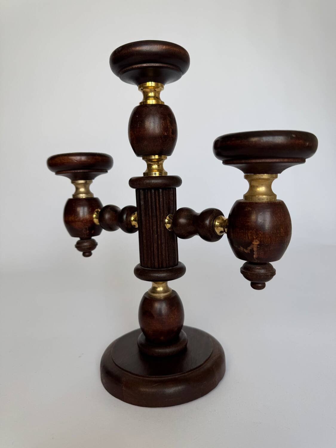 Vintage brutalist wooden candelabrum with gold hardware.