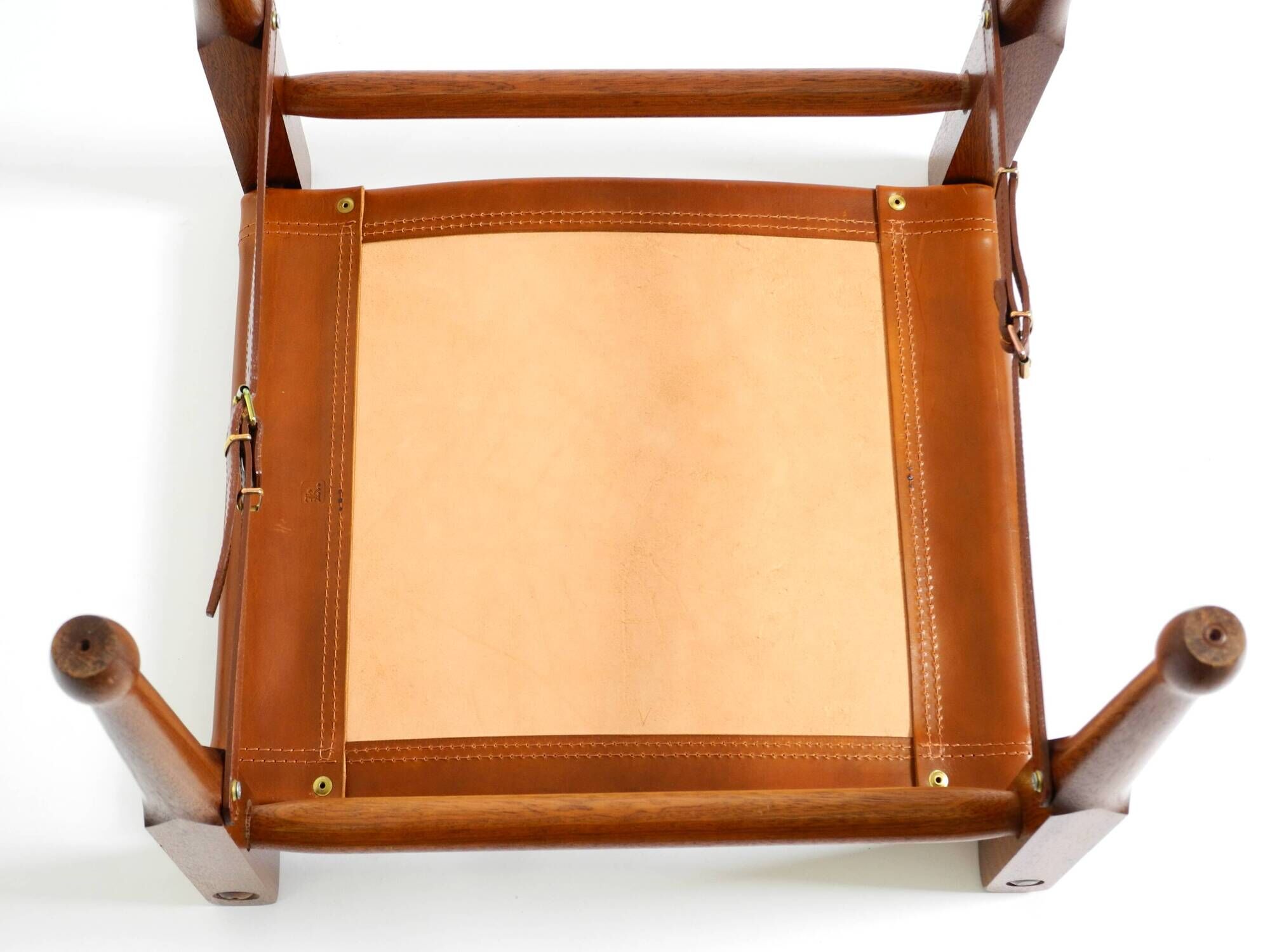 Rare 1990s safari stool with a teak frame and a seat made of brown saddle l