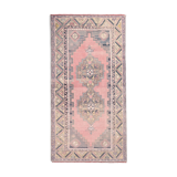 Tapis turc en laine rose poussiéreux