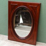 Oval mirror in beveled glass and solid mahogany