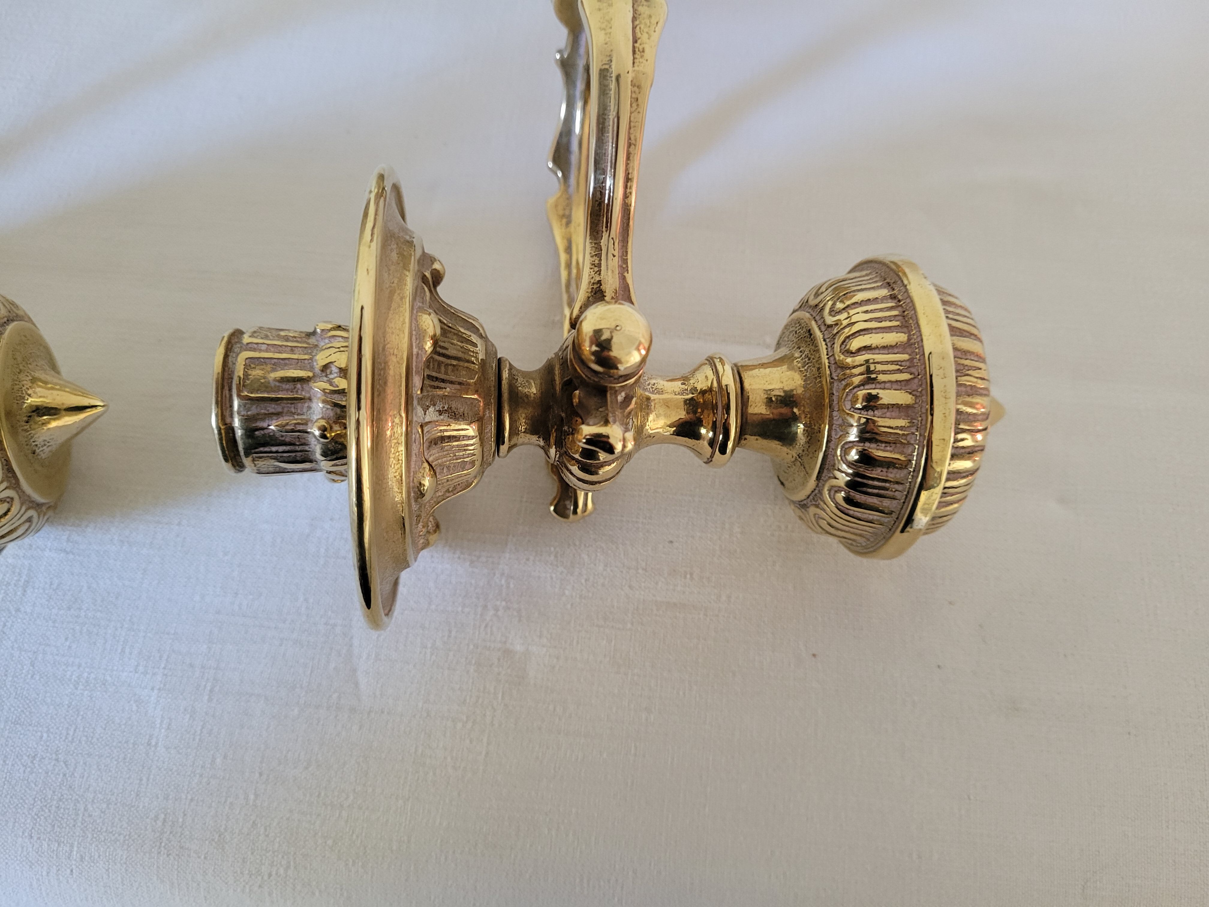 Duo of brass balance wall candle holders