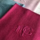 Suite of four antique tinted napkins